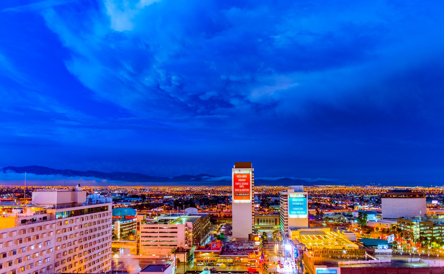 The Sandias at your back: Albuquerque is a valley city you live in, not a skyline you visit