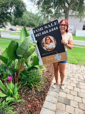The Mayor holding a custom CasaBella lpt realty For Sale sign in front of a St. Cloud home