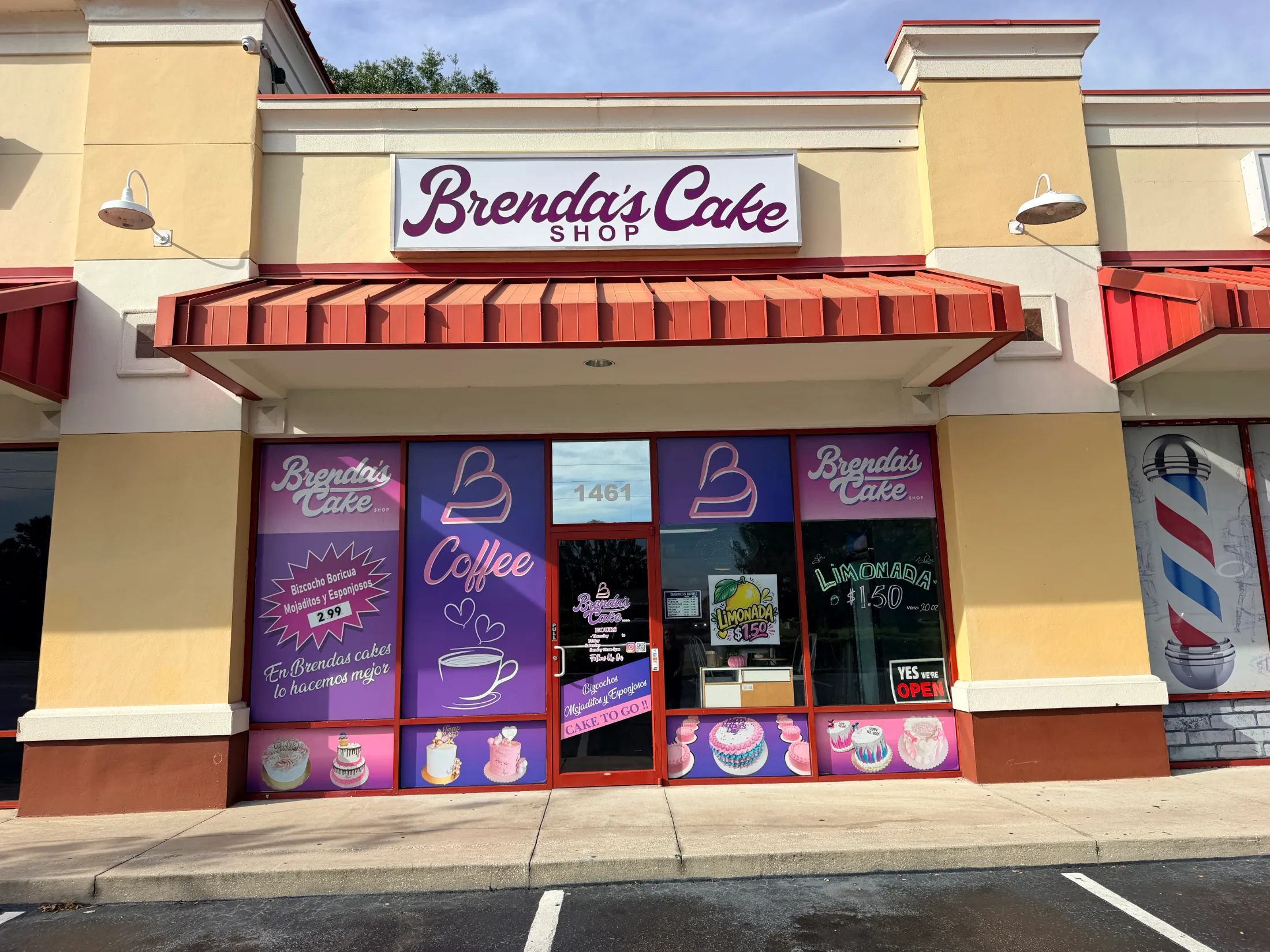 Exterior of Brenda's Cake Shop at 1461 E. Irlo Bronson Memorial Hwy in St. Cloud, Florida, with purple and pink window graphics advertising cake to go and coffee