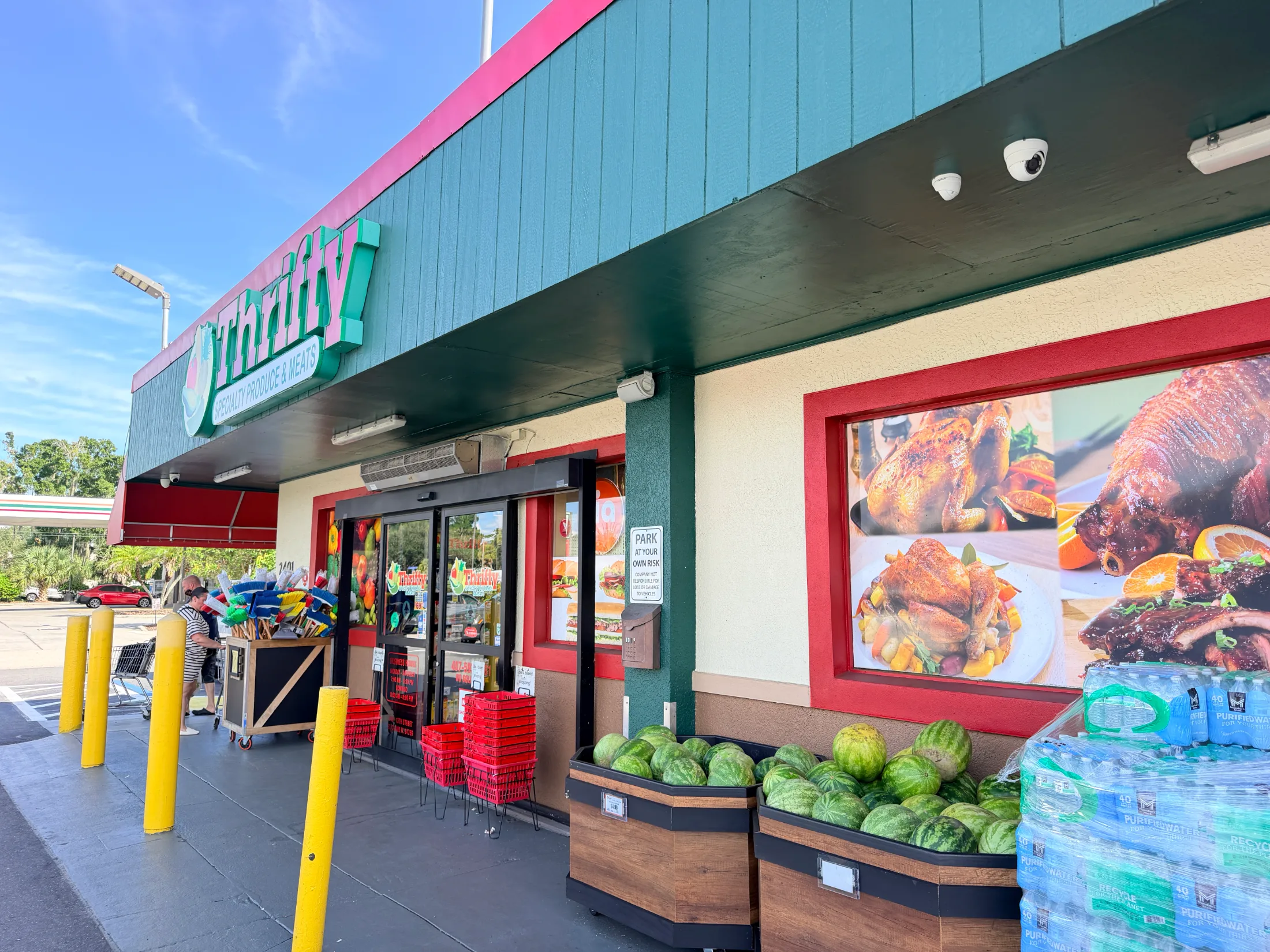 Exterior of Thrifty Specialty Produce and Meat on 13th Street in St. Cloud, Florida, with watermelons displayed out front