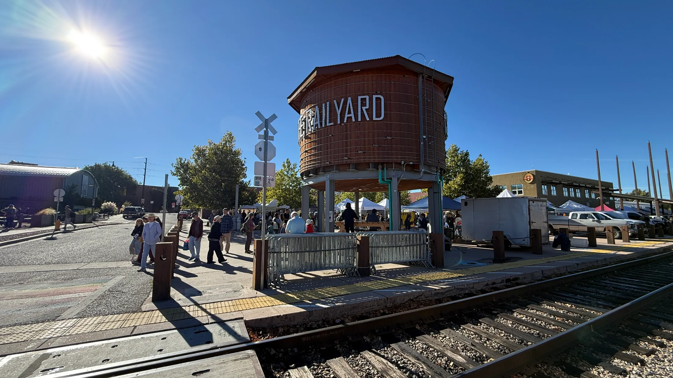 The Railyard water tower and market tents under a bright blue Santa Fe sky