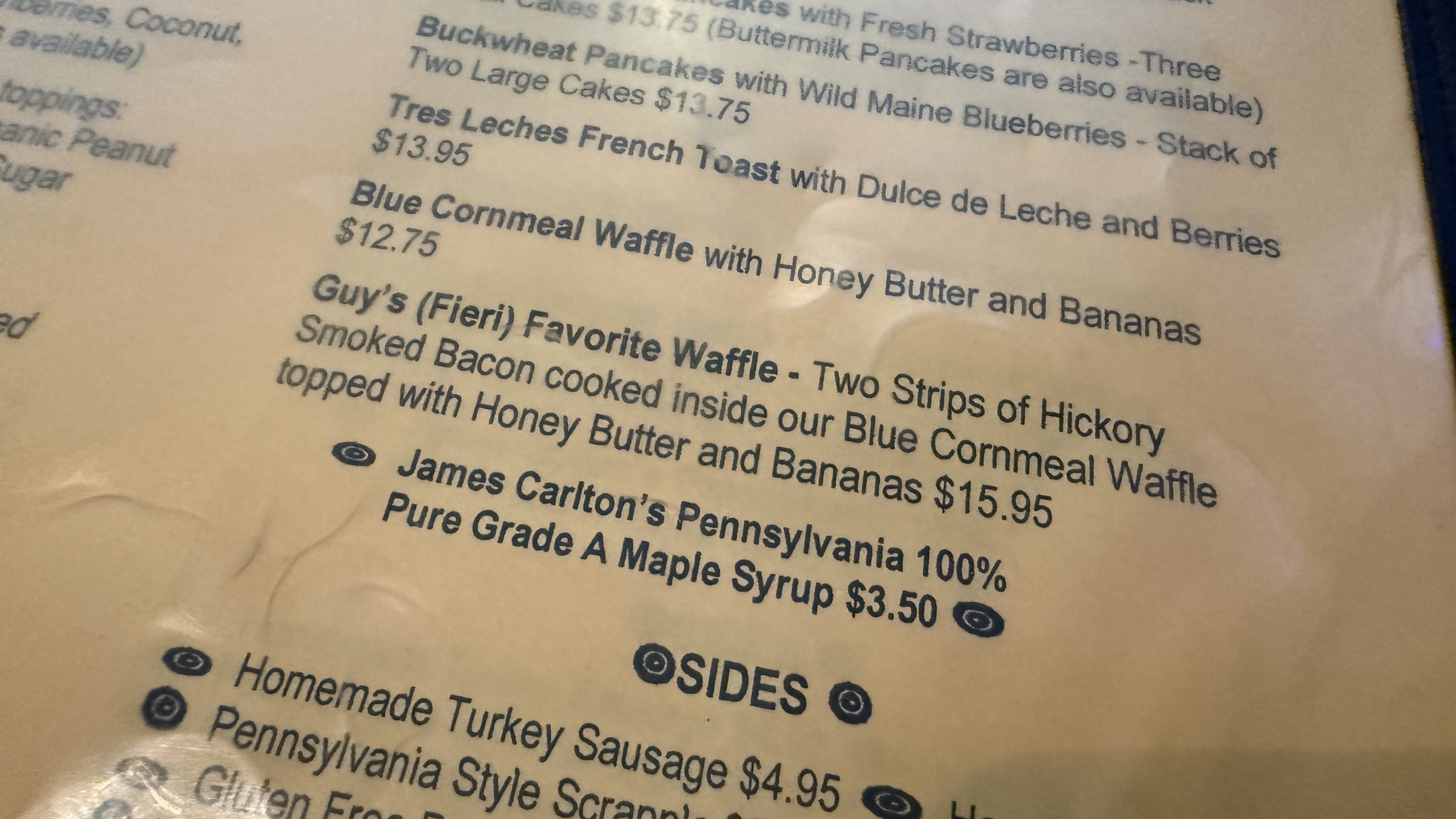The Harry's Roadhouse breakfast menu listing the Blue Cornmeal Waffle and Guy's (Fieri) Favorite Waffle