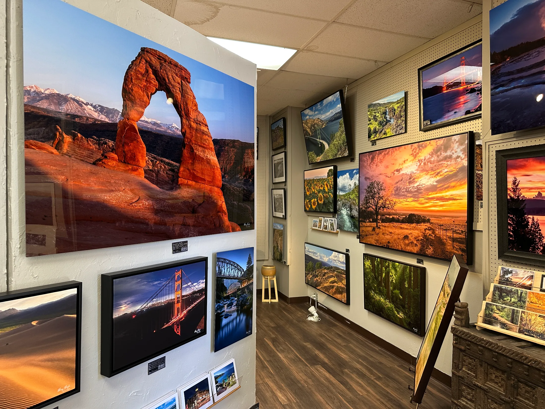 Gallery room with large-format landscape photography prints at Chico Paper Company