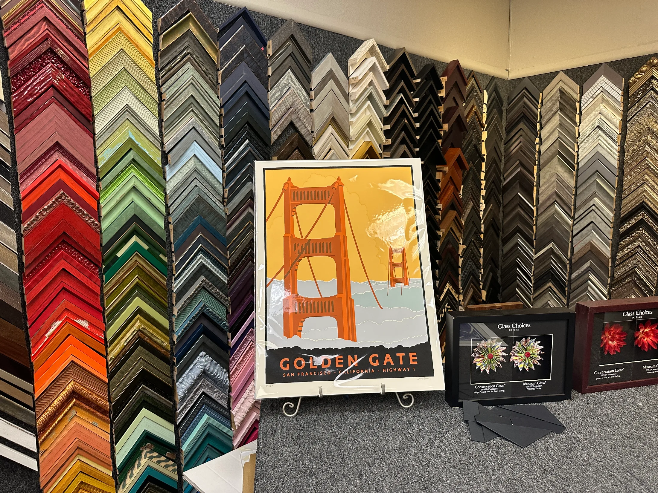 Frame sample wall and glass options display inside Chico Paper Company
