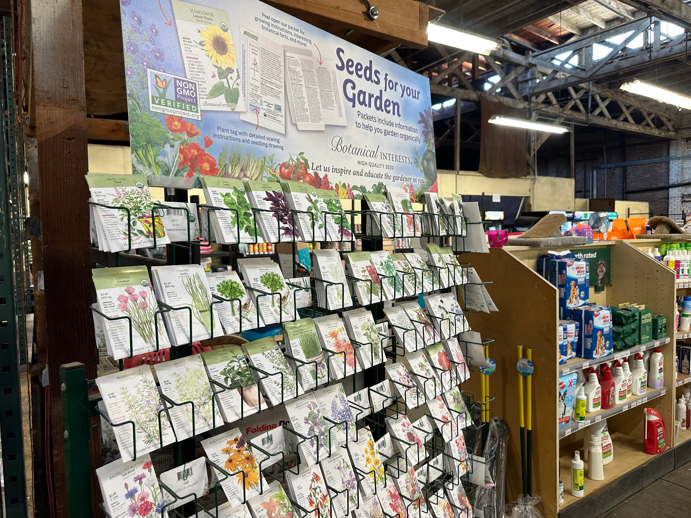 Botanical Interests seed display rack inside Northern Star Mills with non-GMO verified packets