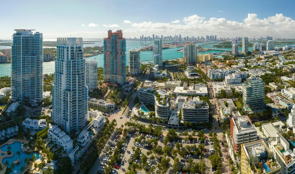 Aerial panorama of South Beach towers, Biscayne Bay, and the Miami skyline beyond
