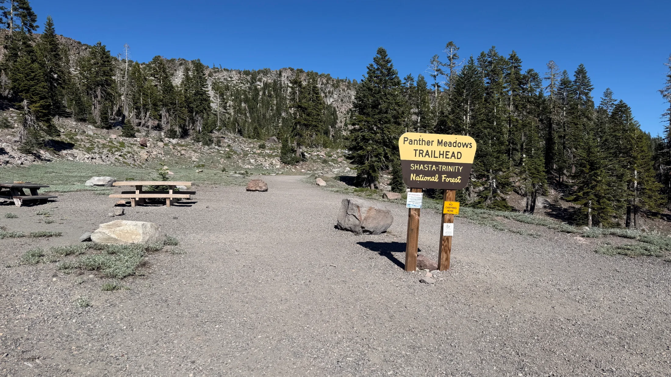 Panther Meadows Trailhead sign for Shasta-Trinity National Forest on a clear blue-sky day