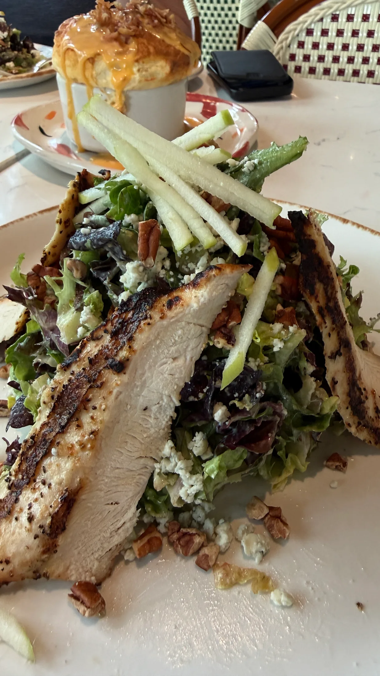 RISE salad with grilled chicken, pecans, blue cheese crumbles, and julienned green apple at Rise Soufflé Fort Worth