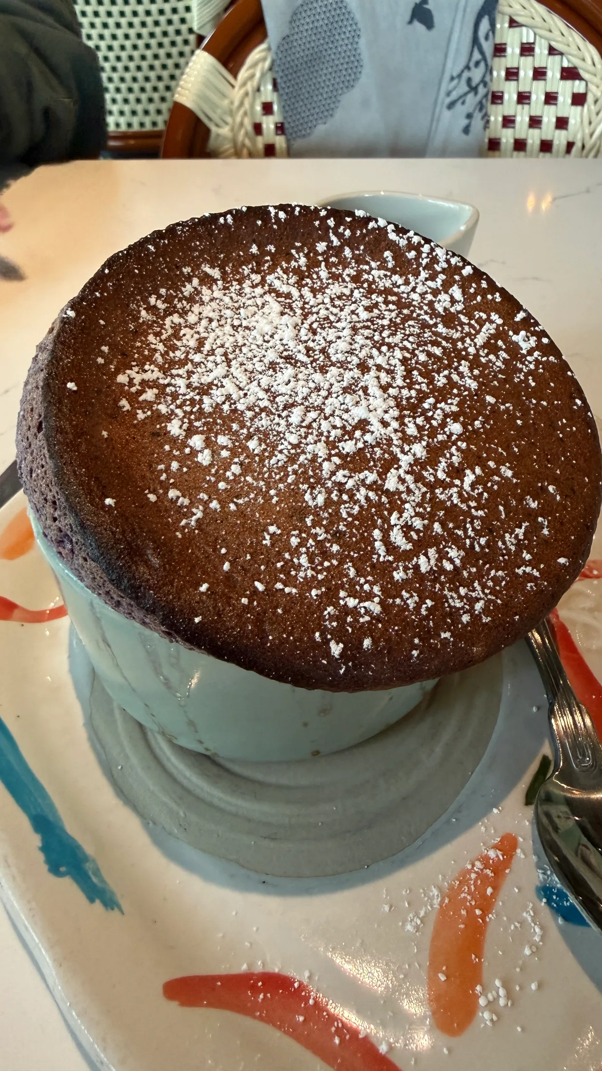 Sweet chocolate soufflé dusted with powdered sugar at Rise Soufflé Fort Worth