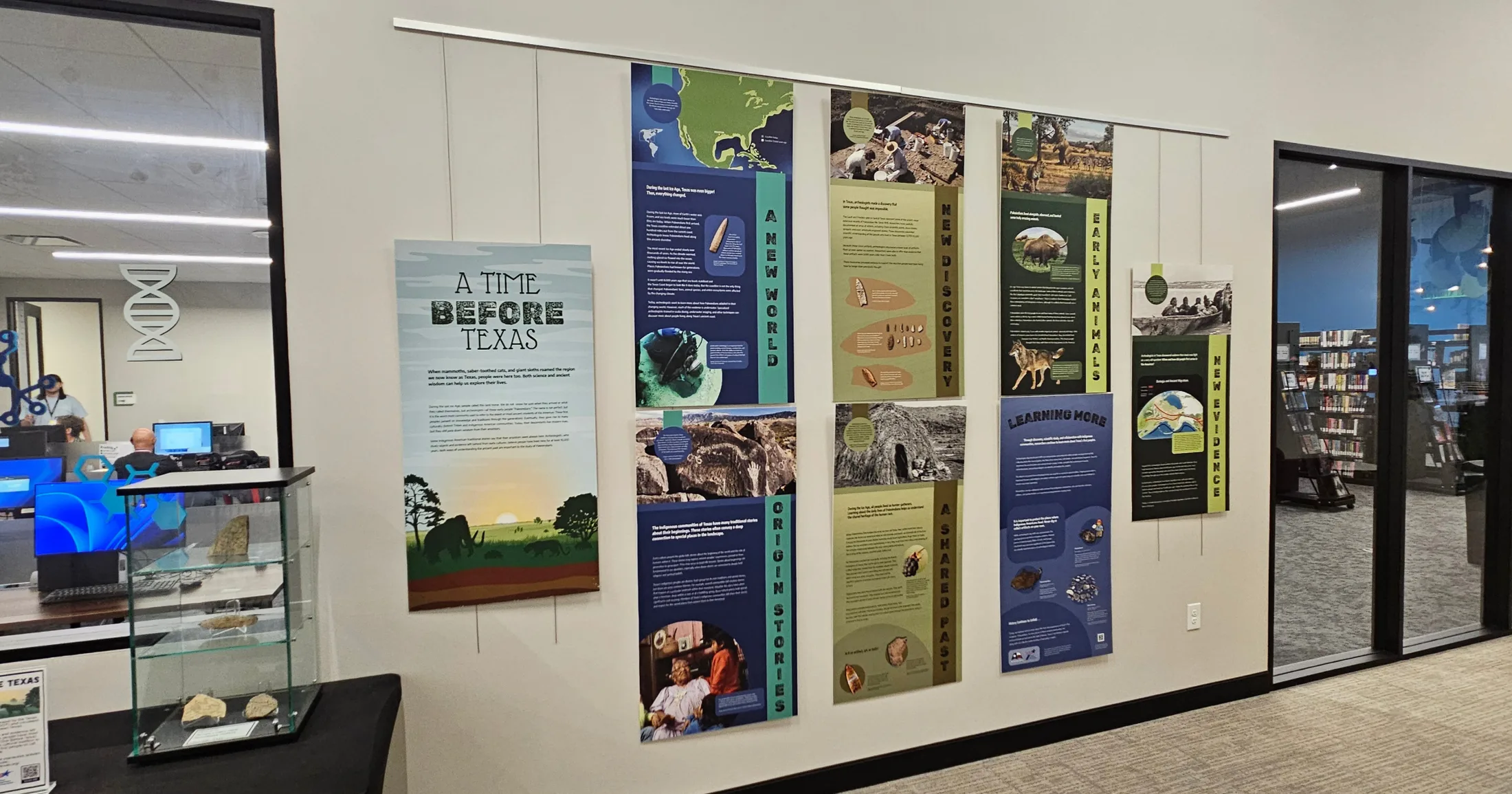 Interior exhibit wall at Kevin Brady Library featuring 'A Time Before Texas' panels on prehistoric Texas history