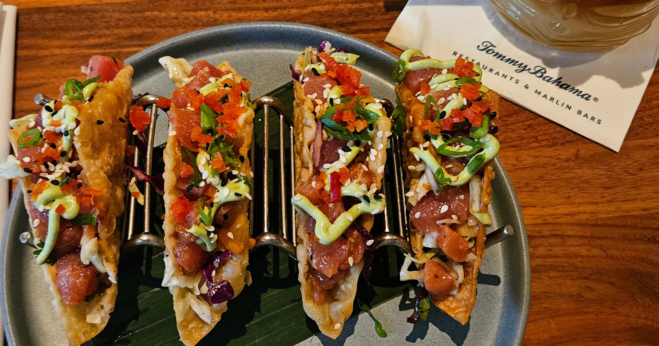 Ahi tuna tacos in wonton shells on a plate at Tommy Bahama Restaurant and Marlin Bar
