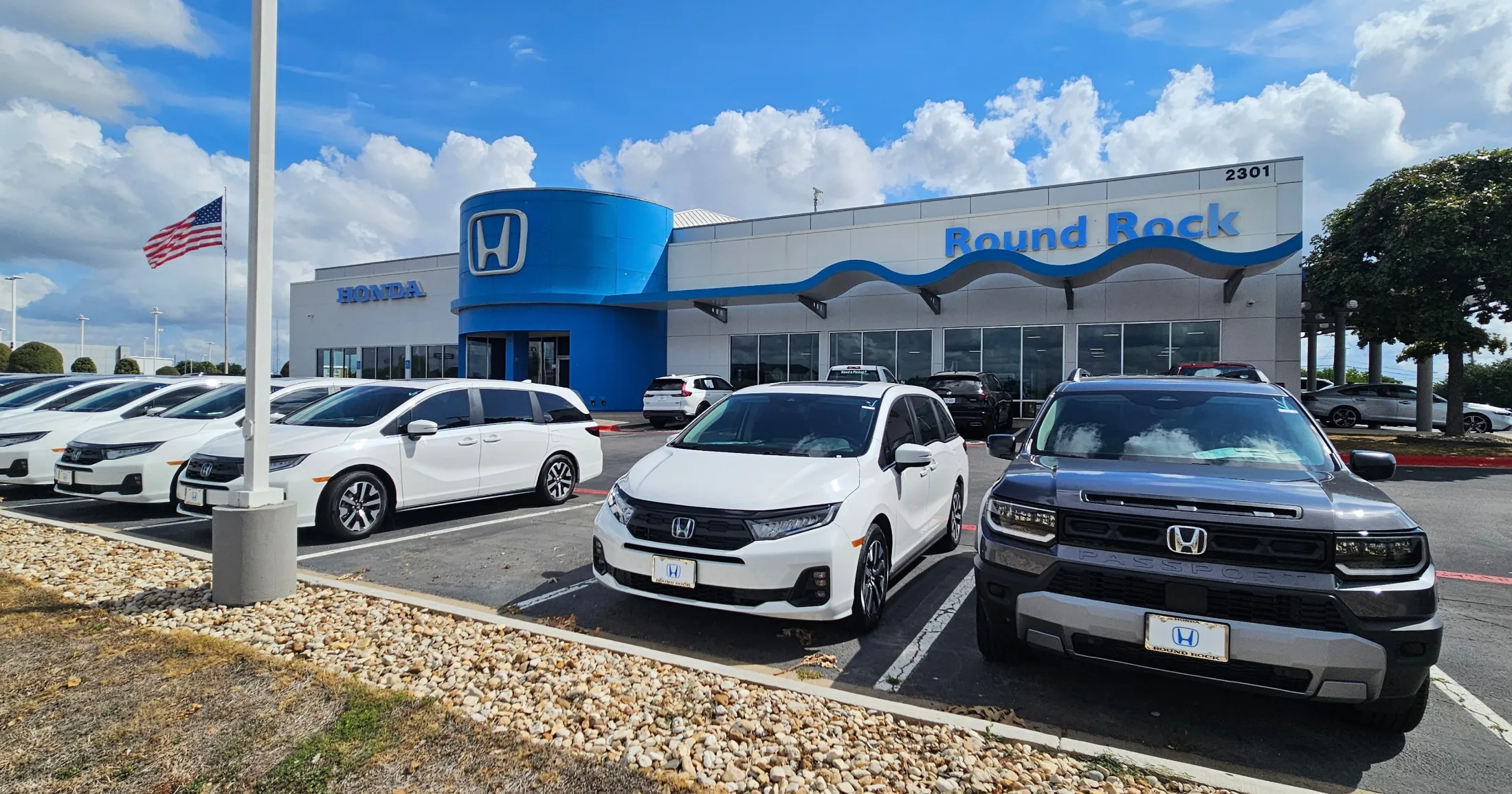 Round Rock Honda exterior at 2301 N Interstate 35 with Passport and Odyssey on the lot