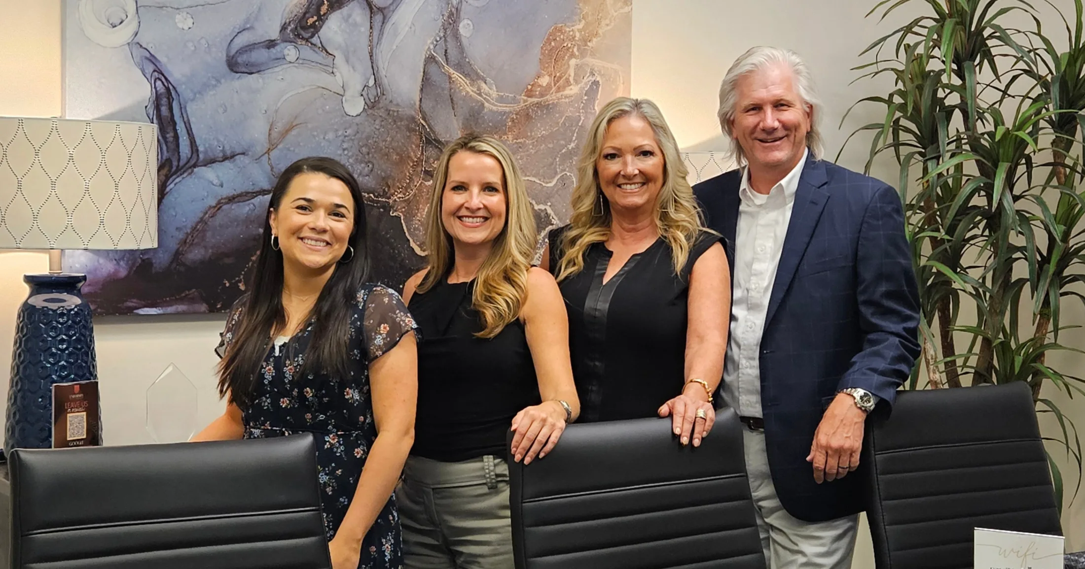 Bria Young, Danell Osborn, Staci Neves, and the Mayor together at University Title Company