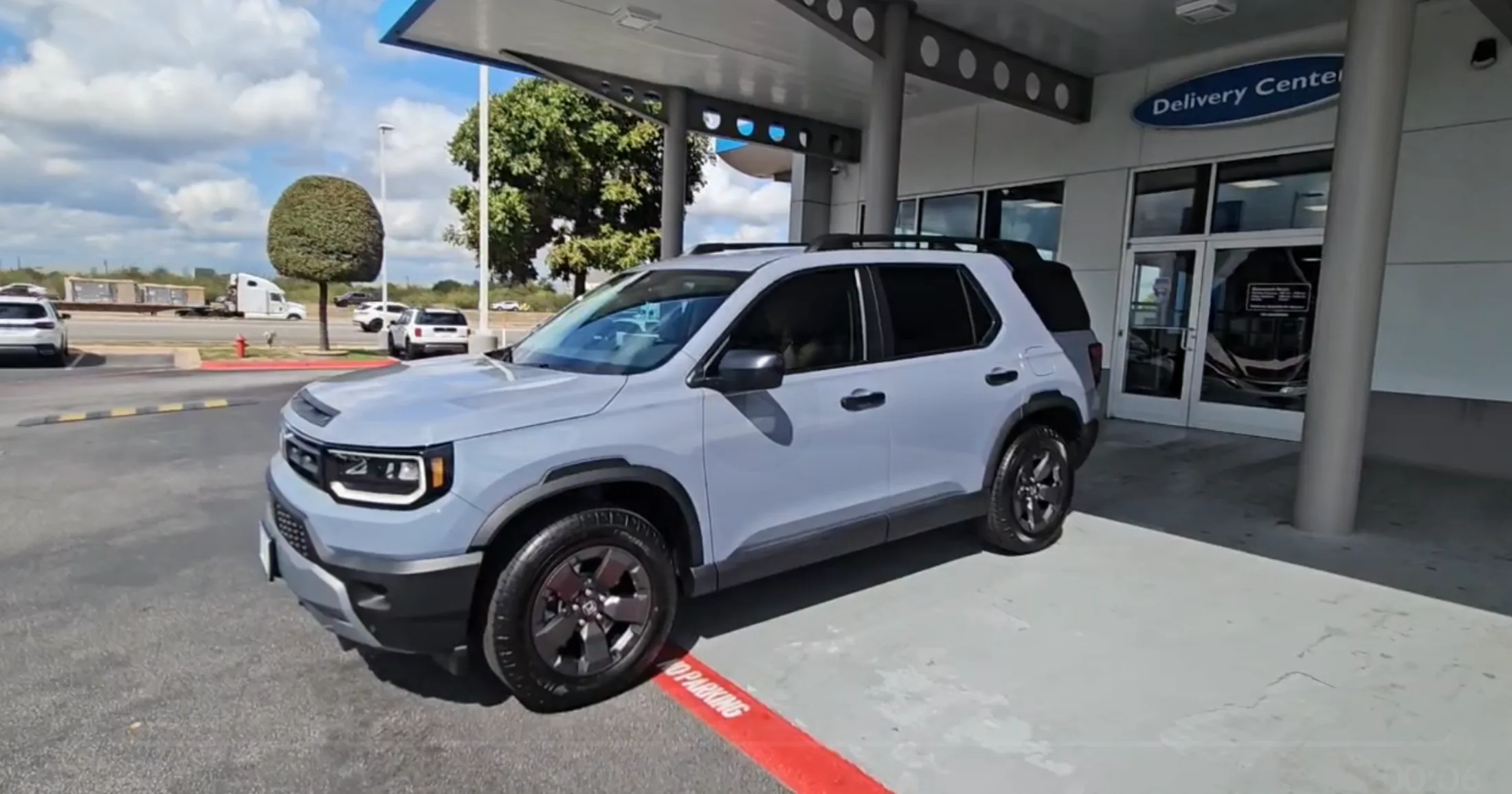 2026 Honda Passport in Sonic Gray Pearl staged at the Round Rock Honda Delivery Center