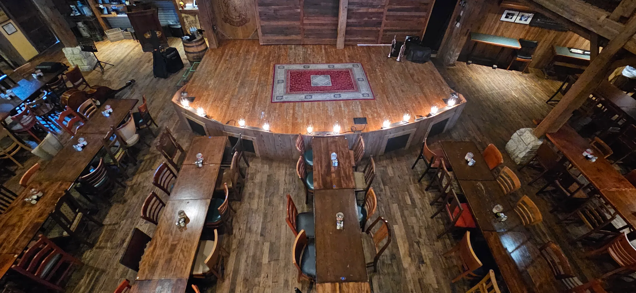 Bird's-eye view looking down at the intimate Dosey Doe stage and dining tables arranged close to the performance area