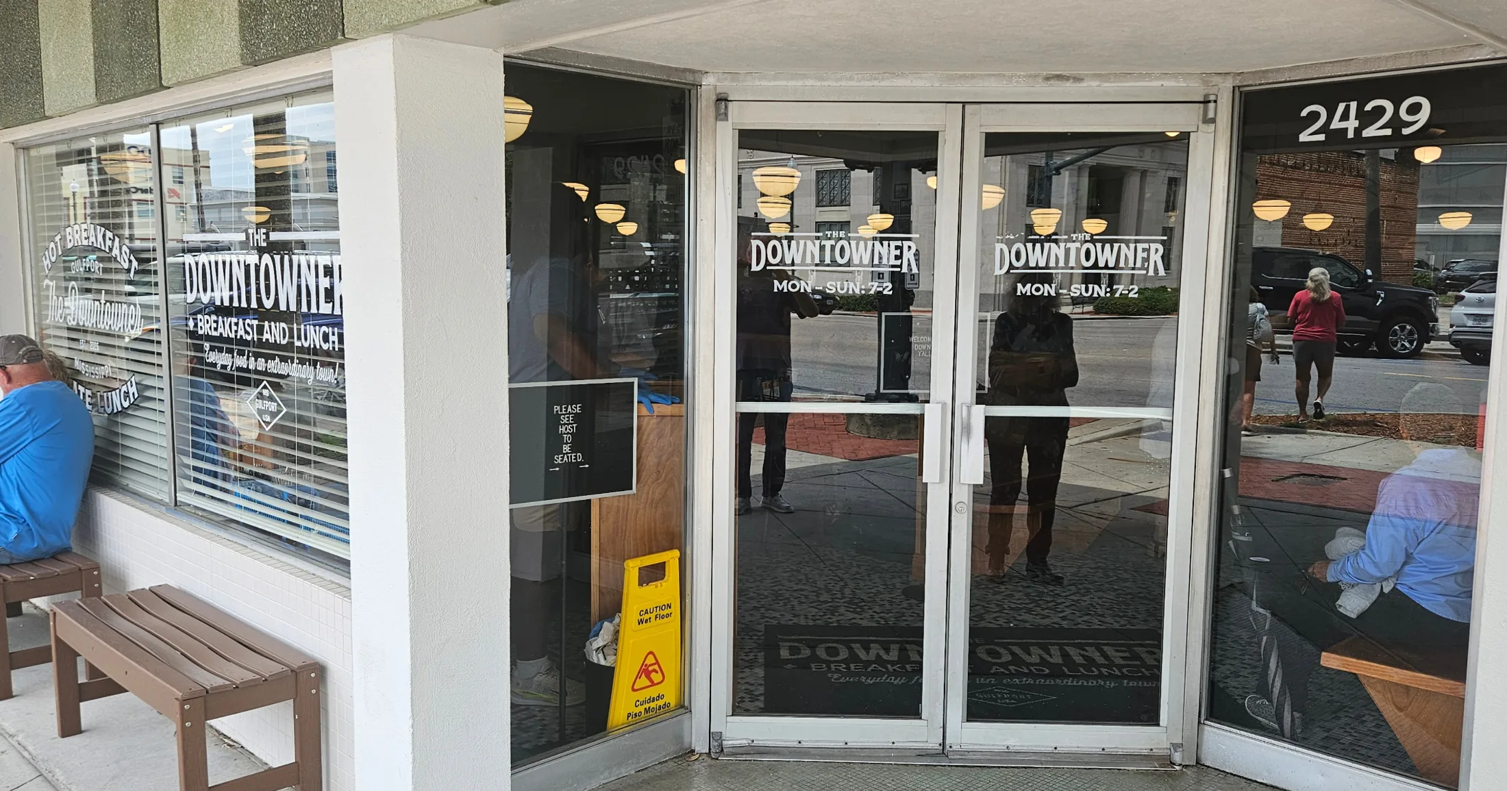 The Downtowner entrance at 2429, with window graphics reading Breakfast and Lunch, Mon–Sun 7–2
