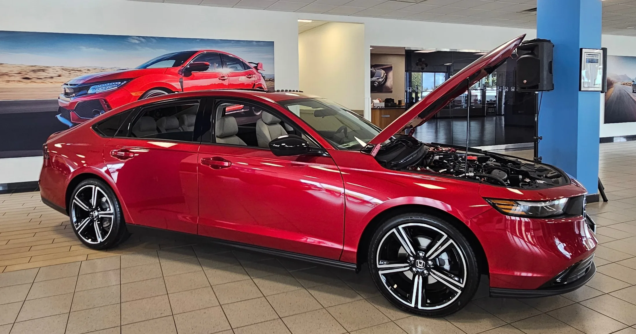 Honda Accord on the showroom floor with hood open at Round Rock Honda