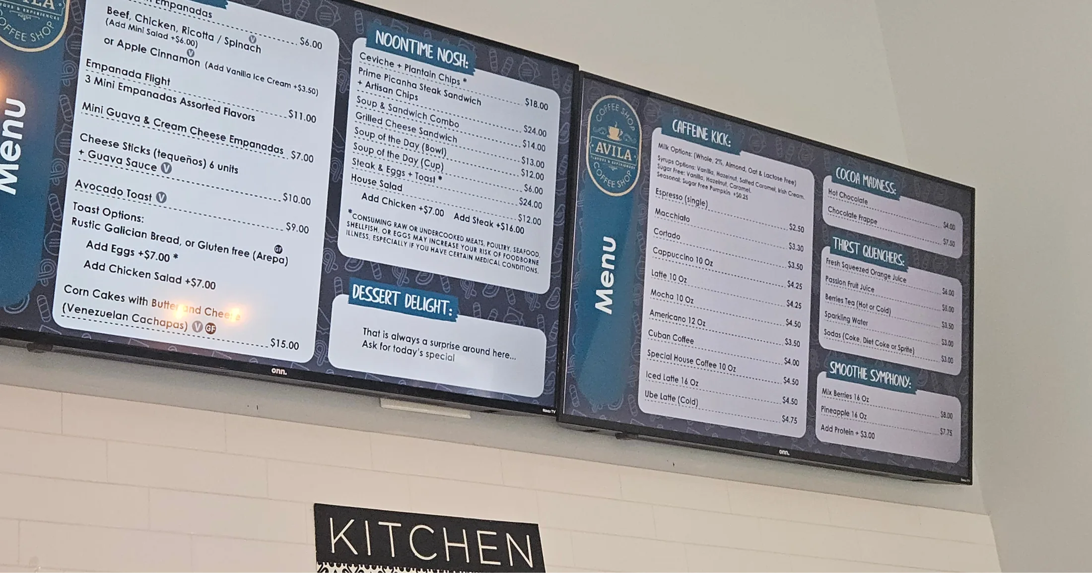 Avila Coffee Shop digital menu boards showing Noontime Nosh, caffeine, and dessert options