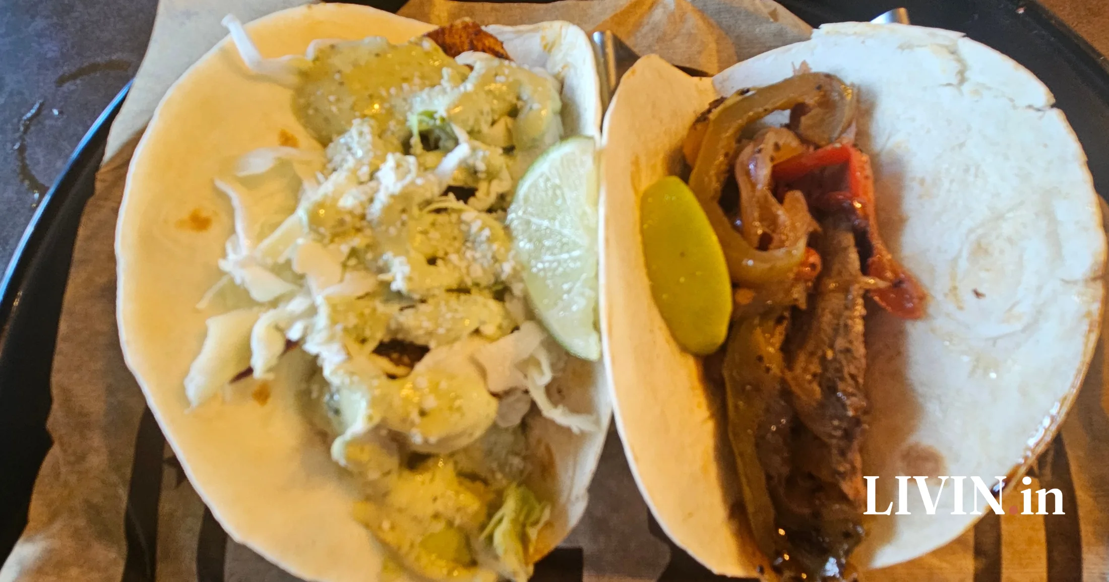 Blackened shrimp taco with cabbage and cotija and a steak fajita taco with peppers and onions at Hee Haw's Tacos and Tequila