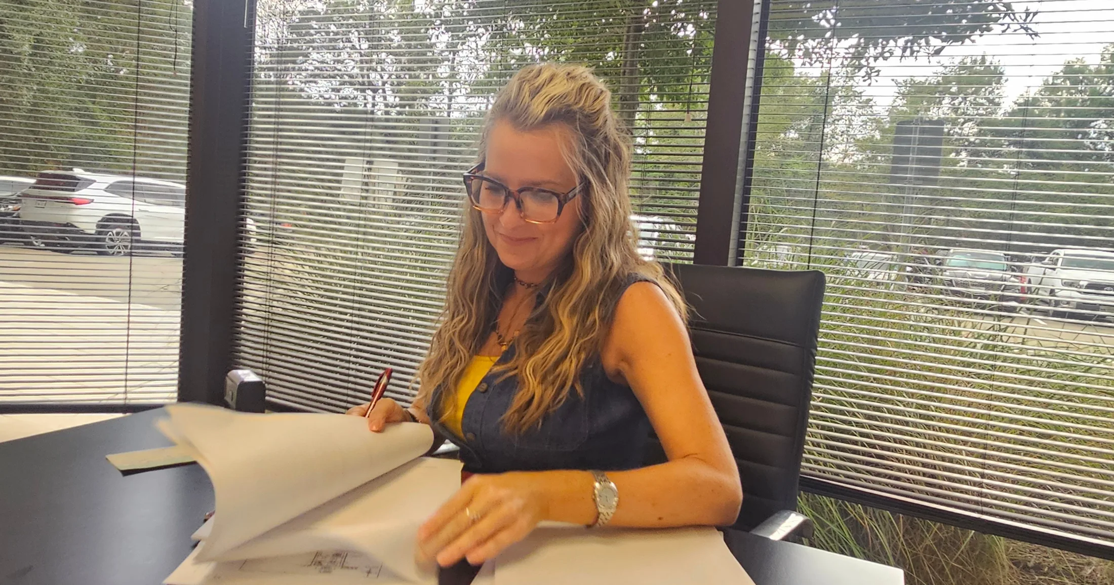 Woman reviewing closing documents at University Title Company