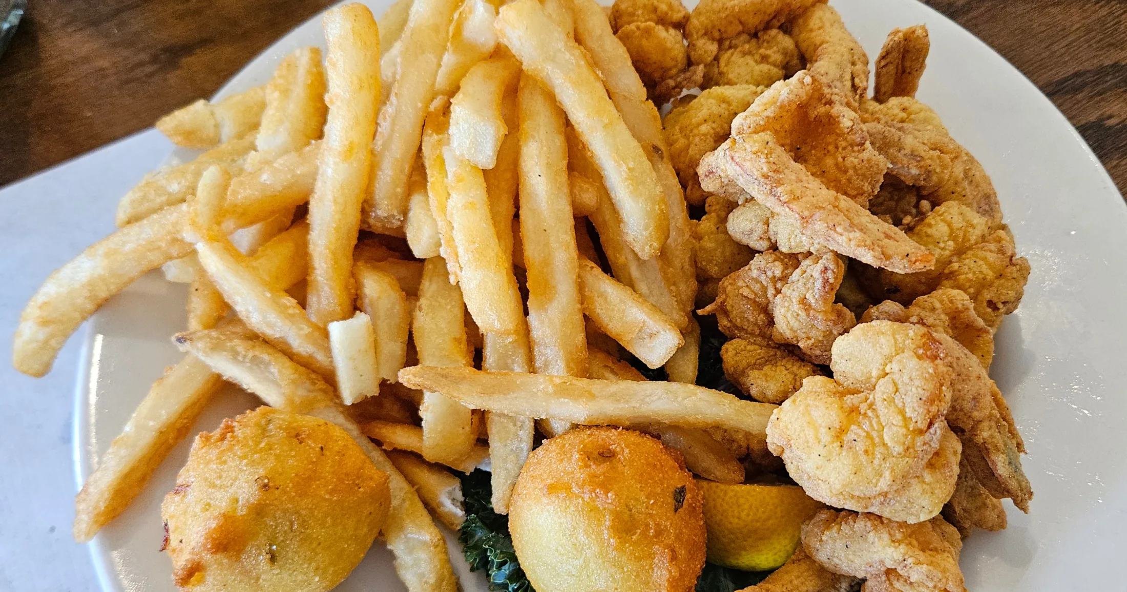 Fried shrimp basket with fries and hush puppies at White Cap