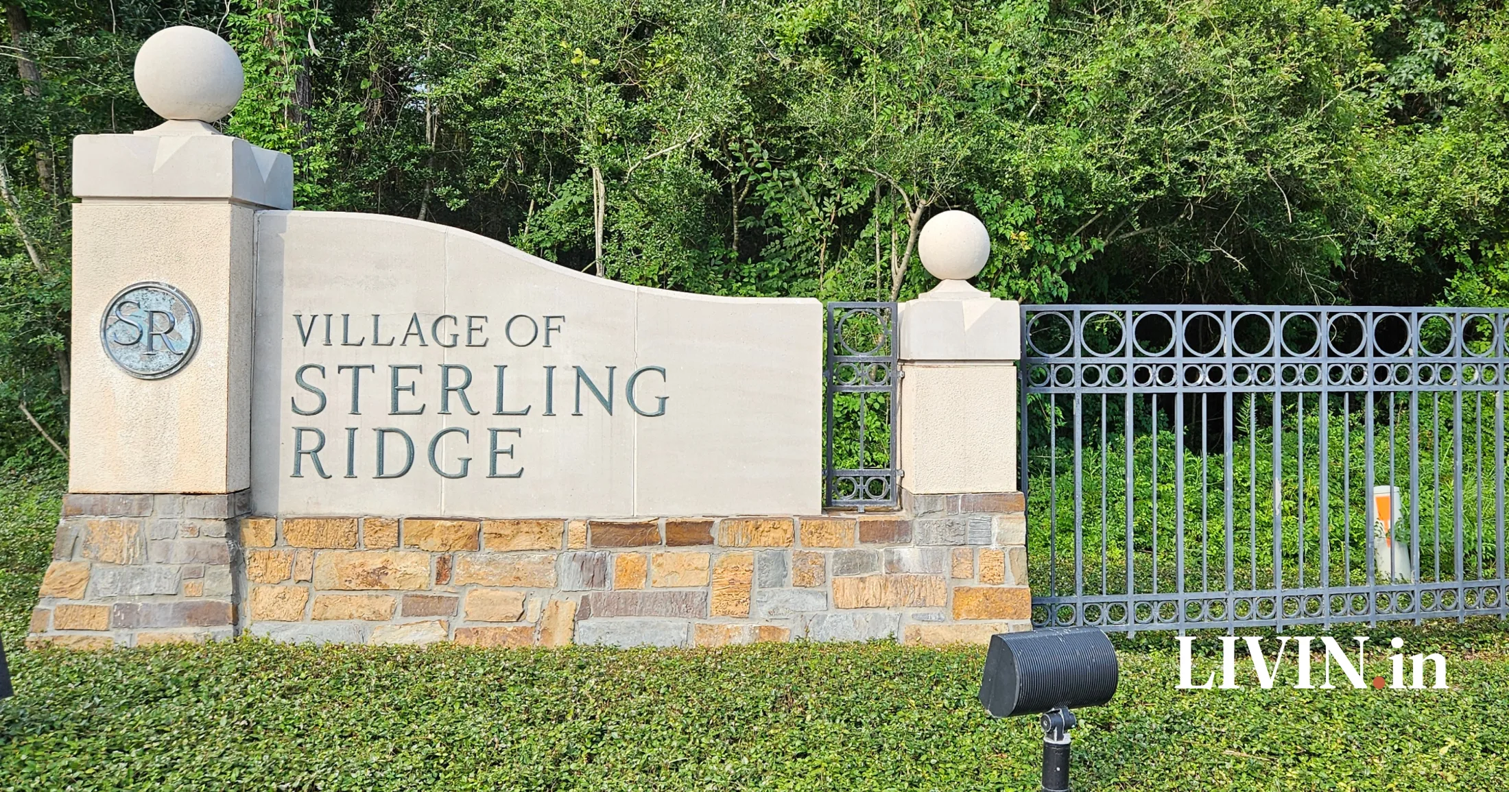 Village of Sterling Ridge stone entrance monument with iron gate, The Woodlands, Texas
