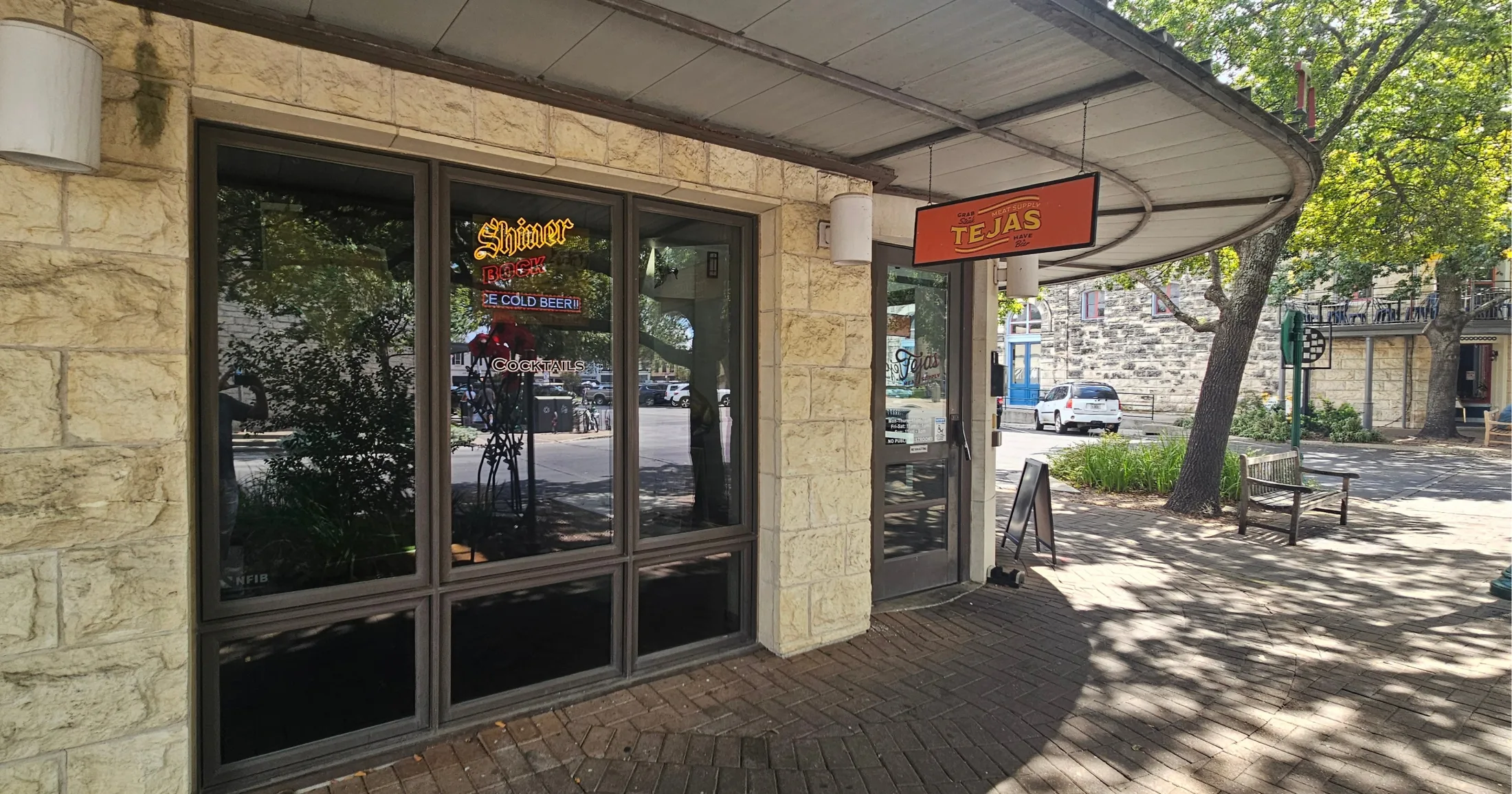Exterior of Tejas Meat Supply on East 7th Street in Georgetown, Texas, with Shiner Bock neon sign