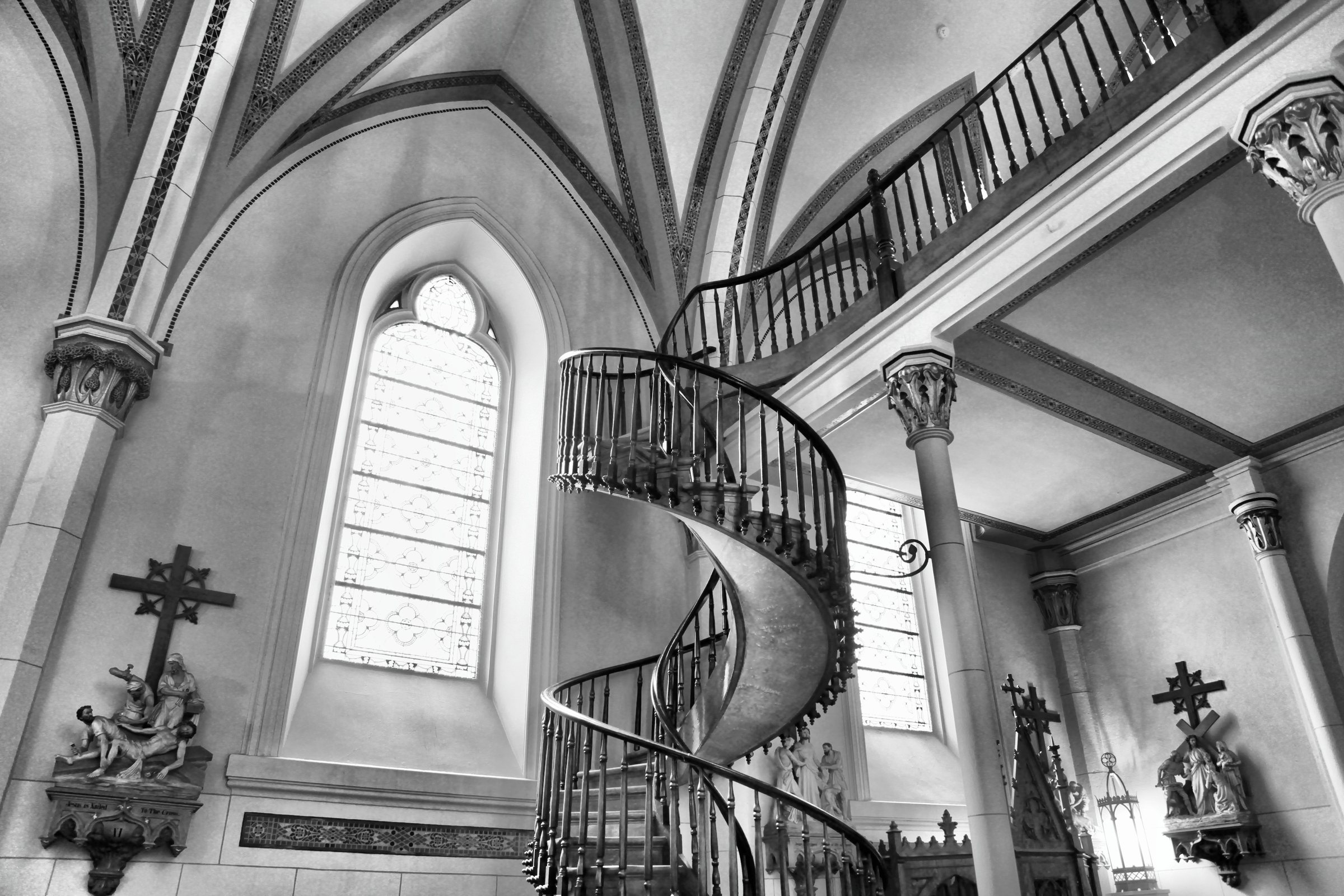 The Loretto Chapel spiral staircase, a wooden helix rising to the choir loft