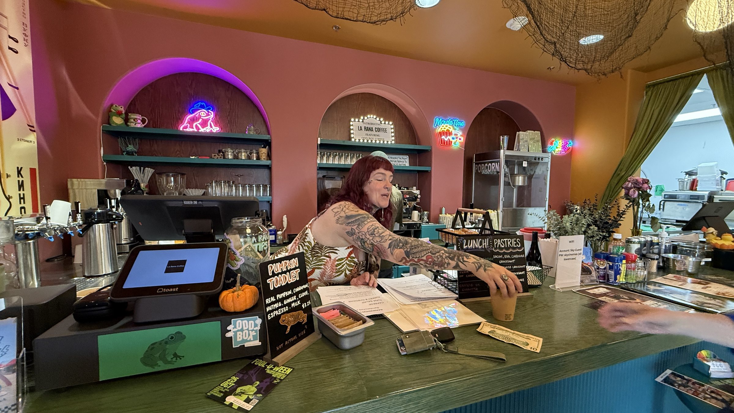 A Pink Neon Frog Glows Over La Rana Coffee in Santa Fe
