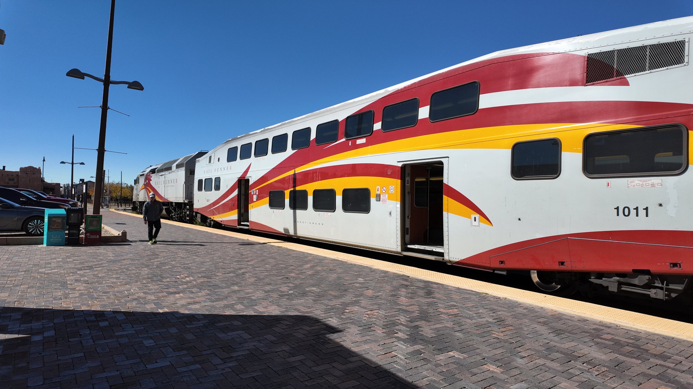 A Rail Runner bilevel coach along the platform