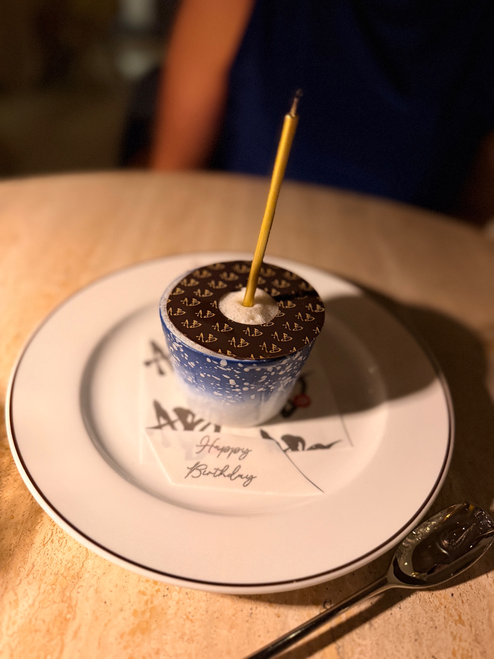 Coffee service at Salt and the Cellar in a white cup with a black rim on a saucer